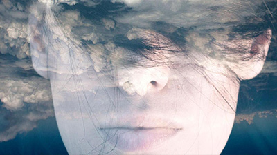Clouds superimposed on a face